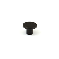 Momo COMO cabinet knob in matte blue finish with a sleek, modern design, mounted on a wooden cabinet door.