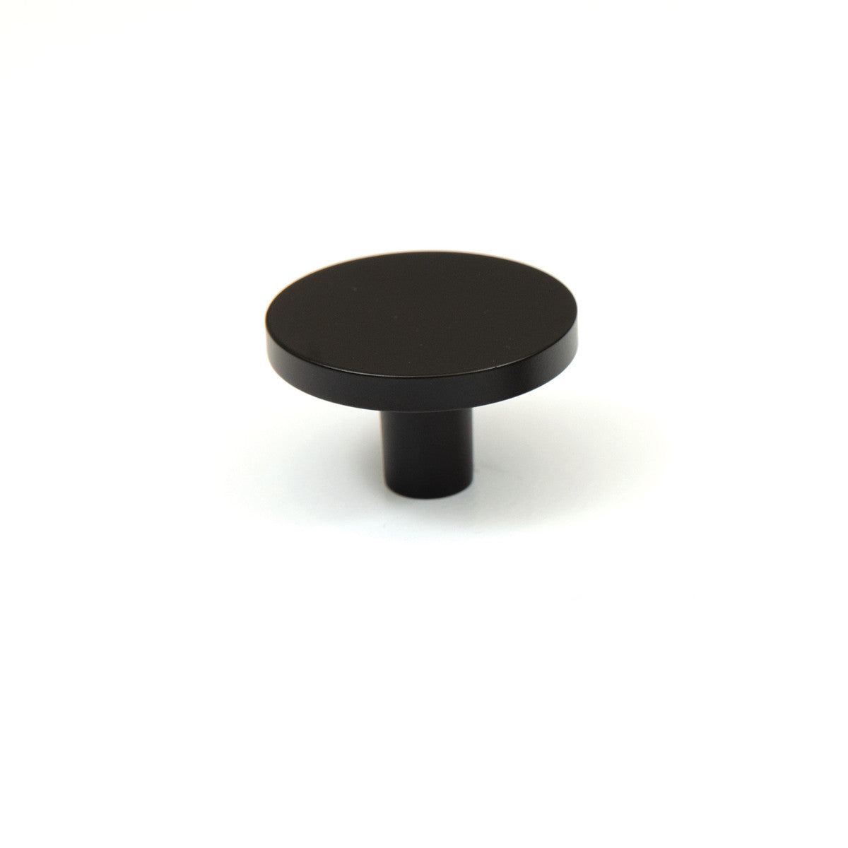 Momo COMO cabinet knob in matte black finish with a sleek, modern design and round shape, suitable for kitchen or furniture hardware.