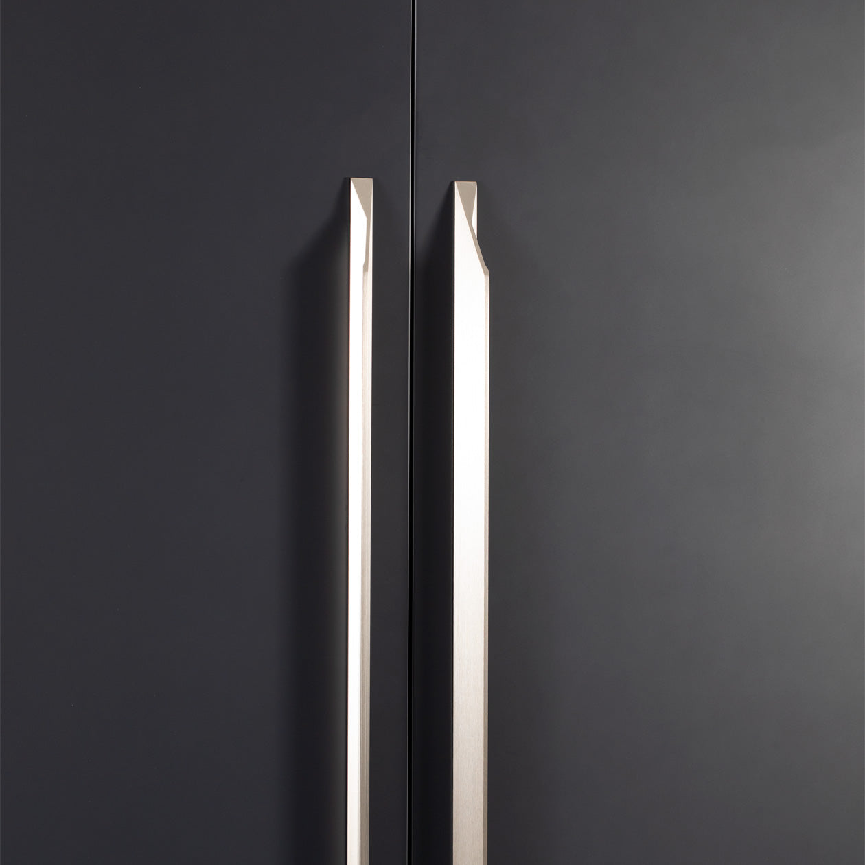 Momo CUTT cabinet pull handle in dark bronze finish, sleek modern design for kitchen or furniture drawers.