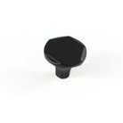 Momo CASELLE cabinet knob in matte black finish, round metal handle for kitchen or furniture drawer doors.