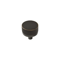 Momo BELLEVUE knurled cabinet knob in dark bronze finish mounted on wood cabinet door.
