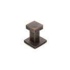 Castella Cast Square Wall Hook mounted on a wall, showing its sleek black metal design for hanging items.