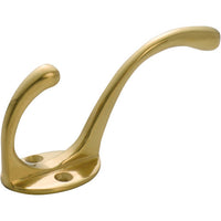 Tradco Victorian hat and coat hook mounted on wall, featuring ornate metal design and multiple hooks for hanging accessories.