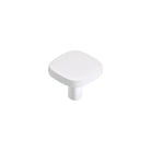 Momo PORTO cabinet knob in white ceramic with bronze accents, mounted on a wooden cabinet door.