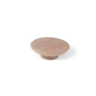 Momo Daintree Timber Full Round Cabinet Pull Handle mounted on wood cabinet, showcasing natural wood finish and rounded design.