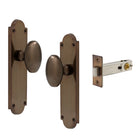 Oval Knob Plate Passage in Antique Bronze