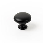 Momo DUKE round cabinet knob in matte blue finish, showing the sleek, circular design suitable for modern furniture.