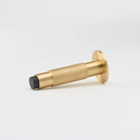 Lo & Co Interiors knurled Kintore doorstop with textured metal finish, standing upright on a flat surface.