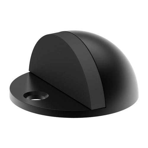 Black dome-shaped door stop by Style Finish Doorware, mounted on a door to prevent it from opening too far.