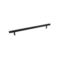 Momo BELLEVUE 600mm knurled entry pull handle mounted on a door, featuring textured metal grip for secure opening.