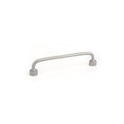 Momo FLOID cabinet pull handle in polished white finish shown on a modern kitchen cabinet.