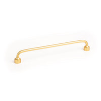 Momo FLOID cabinet pull handle in bronze finish, sleek modern design, mounted on a cabinet door.