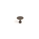 Momo FLOID cabinet knob in matte beige with sleek round design, mounted on a wooden cabinet door.