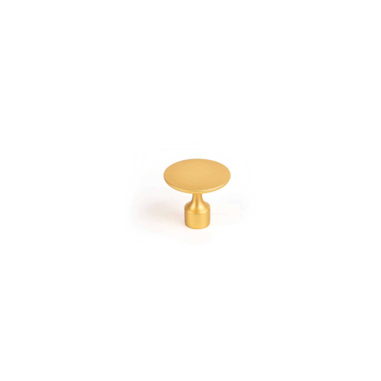 Brass Momo FLOID cabinet knob with sleek design, mounted on a wooden cabinet door.