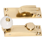 Sash Fastener Porcelain Ball Polished Brass L73xW26mm in Polished Brass