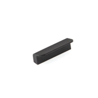 Momo FLAPP cabinet pull handle in black with a sleek, modern design, mounted on a cabinet door.
