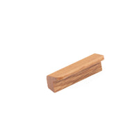 Momo FLAPP Timber Cabinet Pull Handle in oak finish mounted on a cabinet door, showcasing sleek wooden design and ergonomic grip.