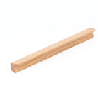 Momo FLAPP timber cabinet pull handle in oak finish mounted on a cabinet door, showcasing natural wood grain and sleek design.