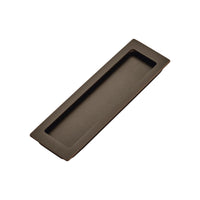 Momo sliding door flush pull handle in dark bronze finish, installed on a modern interior door for sleek, functional design.