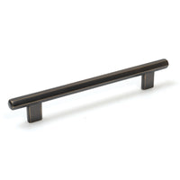 Momo HENDRIX cabinet pull handle in brushed aluminum with sleek, modern design on a wooden cabinet.