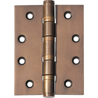 Tradco ball bearing hinge showing metal construction and smooth pivot mechanism for durable door installation.