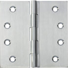 Tradco fixed pin hinge showing metallic construction and mounting holes, used for doors and cabinets.