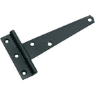Tradco iron strap hinge attached to a wooden door, showing a rustic, durable hardware detail for outdoor or barn doors.