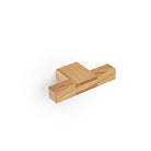 Momo HAKO cabinet with T-pull handle in oak finish, showcasing sleek modern design and natural wood grain detail.