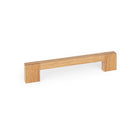 Momo HAKO timber cabinet pull handle in oak finish, sleek and modern design, mounted on a cabinet door.