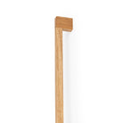 Momo HAKO Big D Timber Cabinet Pull Handle in oak wood with a sleek, modern design for kitchen or furniture cabinetry.