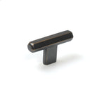 Momo Hendrix cabinet T-pull handle in antique brass finish, sleek design visible on a modern wooden cabinet door.