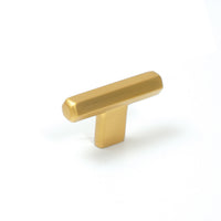 Bronze Momo Hendrix cabinet T-pull handle with a sleek, modern design, mounted on a cabinet door for easy opening.