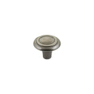 Momo WINCHESTER cabinet knob in polished white finish with decorative design, mounted on a wooden cabinet door.