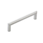 Stainless steel Momo BERGAMO cabinet pull handle with sleek, modern design mounted on a cabinet door.