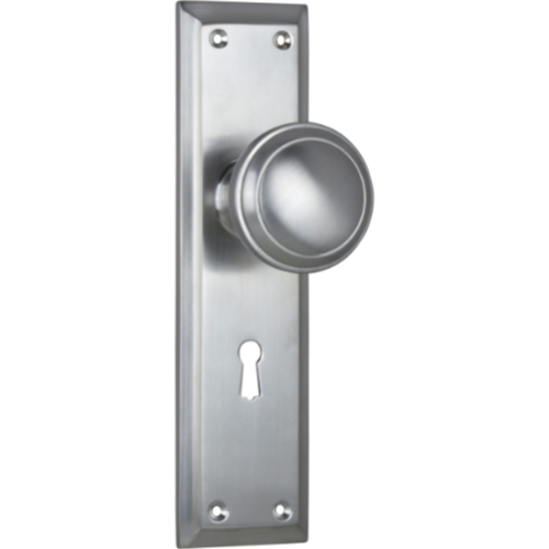 Pair of Tradco Milton door knobs on long backplates, featuring classic design and polished finish, ideal for interior doors.