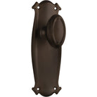 Pair of Tradco Bungalow Knobs on long backplates, showing vintage-style brass door hardware with ornate detailing.