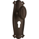 Pair of Tradco Bungalow Knobs on long backplates, featuring vintage-style metal handles for cabinet or door decor.
