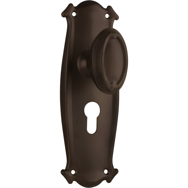 Pair of Tradco Bungalow Knobs on long backplates, featuring vintage-style metal handles for cabinet or door decor.