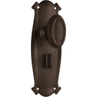 Pair of Tradco Bungalow Knobs on long backplates, vintage-style door hardware with decorative brass finish.