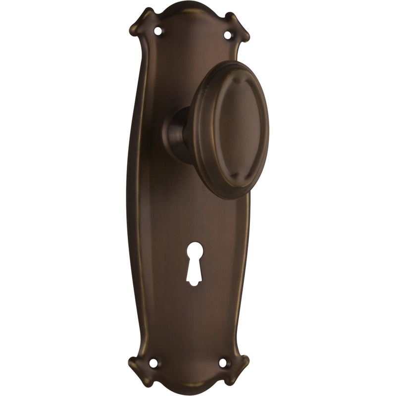 Pair of Tradco Bungalow door knobs on long backplates, featuring vintage-style hardware for classic interior decor.