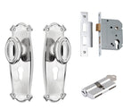 Pair of Tradco Bungalow Knobs with long backplates, showcasing vintage-style door hardware in a rustic finish.
