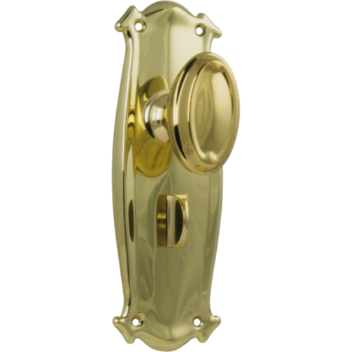 Pair of Tradco Bungalow Knobs on long backplates, featuring vintage-style brass door handles and decorative hardware.