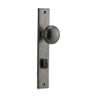 Pair of Iver Paddington knobs on rectangular backplates, showcasing elegant architectural hardware for doors.