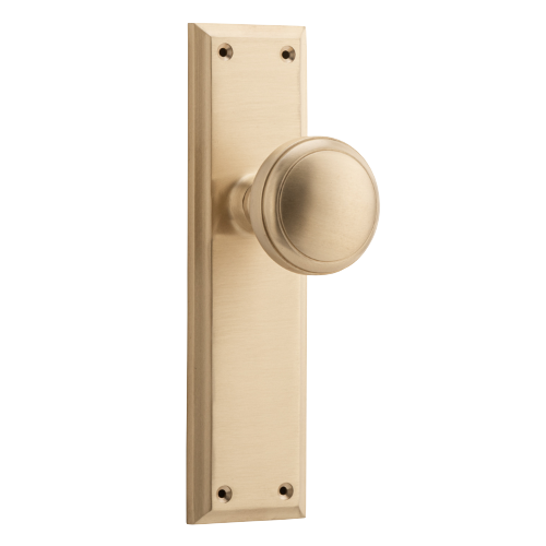 Pair of Tradco Milton door knobs with long backplates, featuring classic design and polished finish.