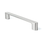 Momo LUV cabinet pull handle in brown with a sleek, modern design, mounted on a wooden cabinet door.