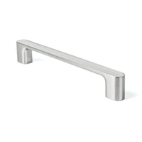 Momo LUV cabinet pull handle in brown with a sleek, modern design, mounted on a wooden cabinet door.