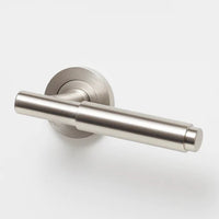 Lo & Co Lola Lever handle in brushed nickel finish, showcasing a sleek modern design on a door handle.