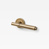 Lo & Co Lola Lever door handle in brushed bronze finish, featuring a sleek modern design with a rounded lever and mounting plate.