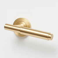 Lo & Co Lola Lever door handle in matte black with sleek modern design, mounted on a white door.