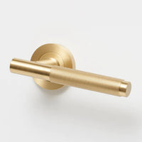 Lo & Co Kintore knurled lever handle in matte finish, featuring textured grip and modern design for interior doors.